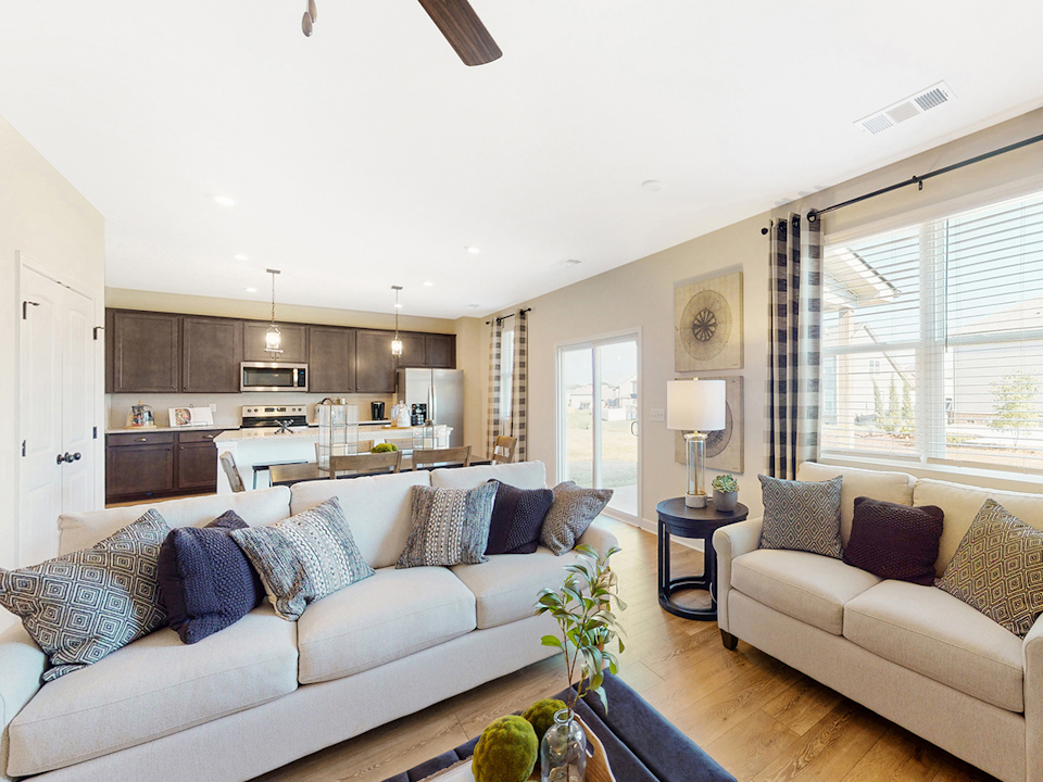 A living room with a couch and a table.
