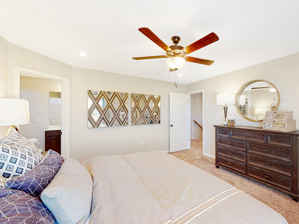A living room with a ceiling fan.
