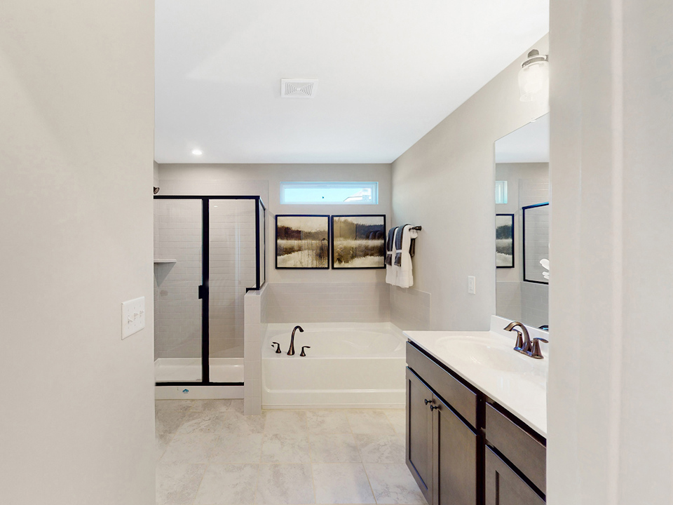 A bathroom with a tub and sink.
