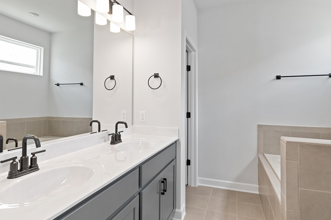 A bathroom with a sink and a bathtub.