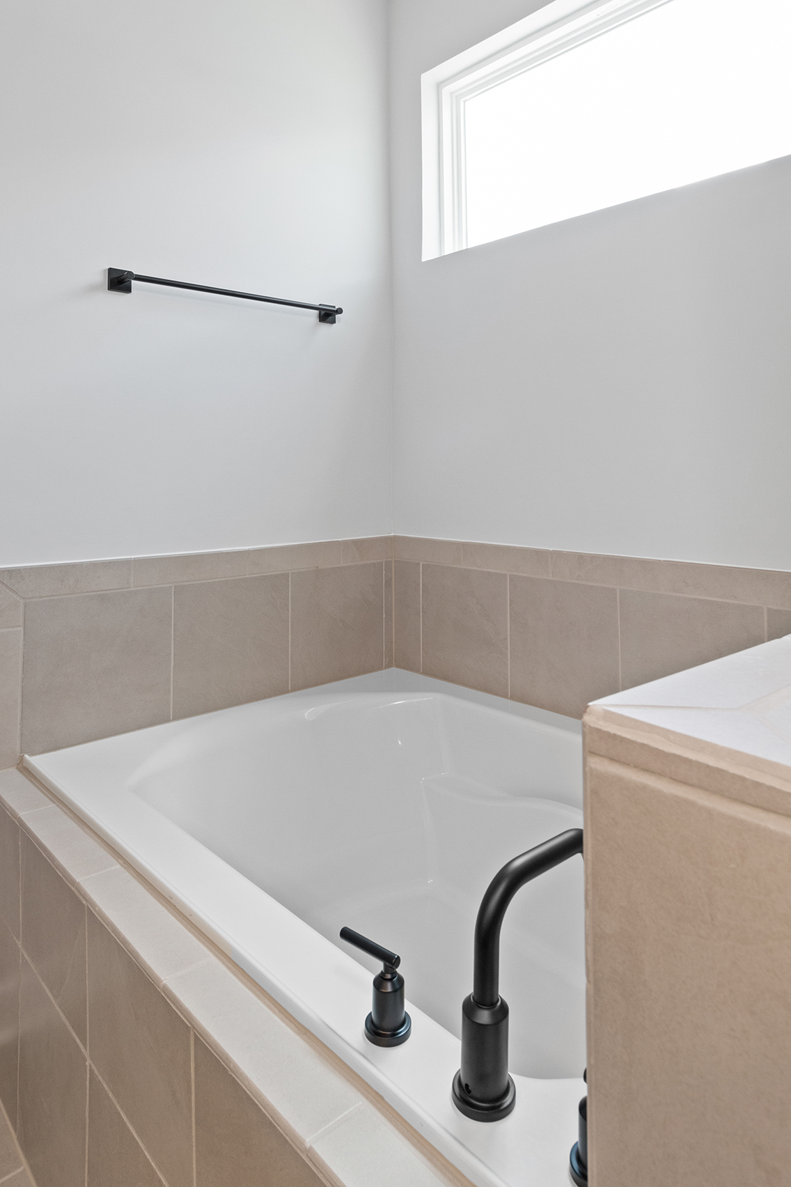 A bathtub in a bathroom.