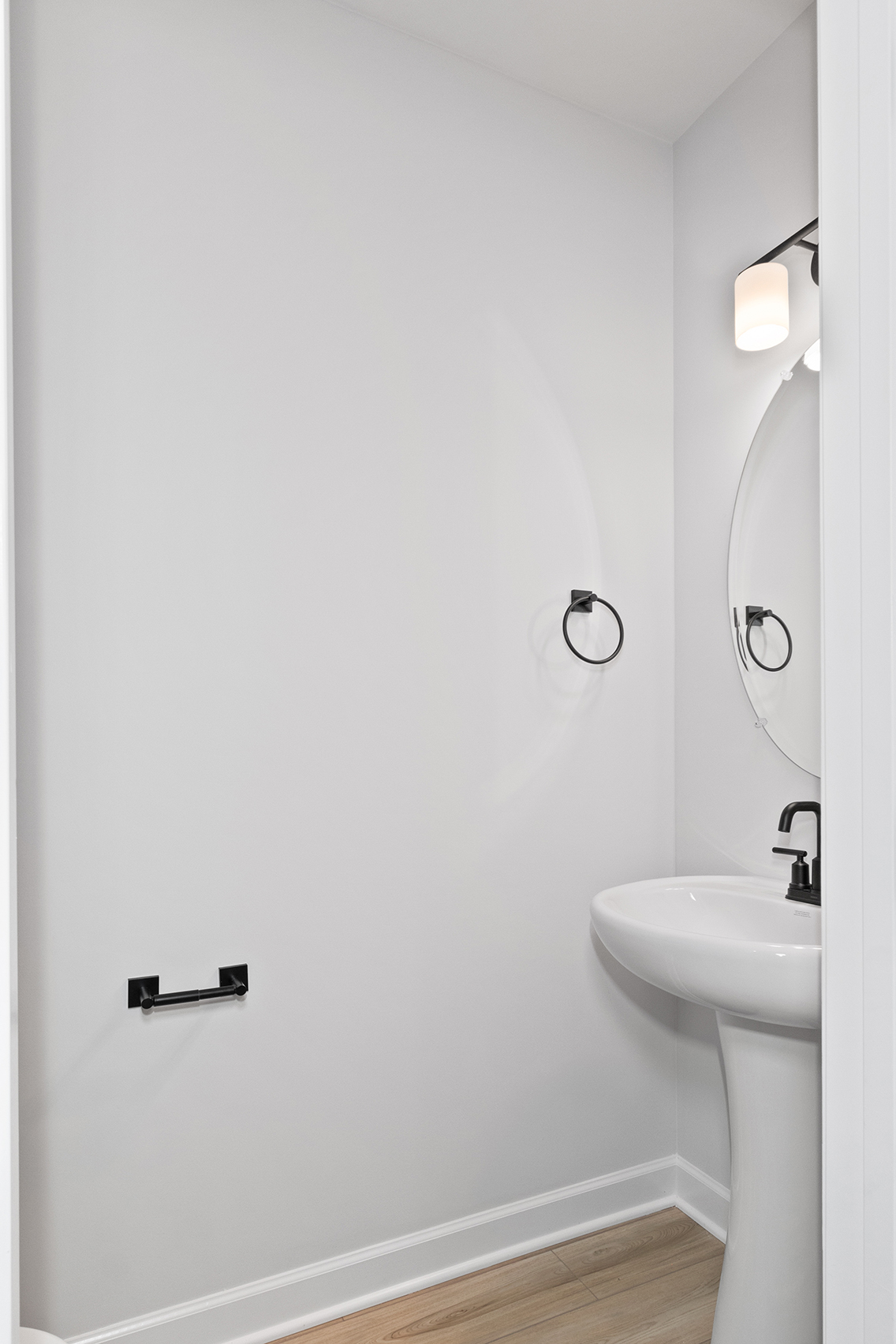 A bathroom with a mirror and sink.