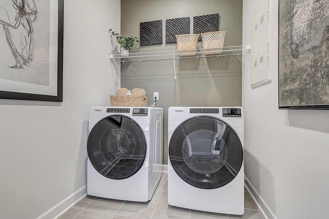 A washing machine in a room.