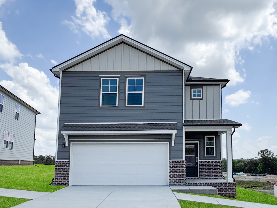 A small house with a garage.