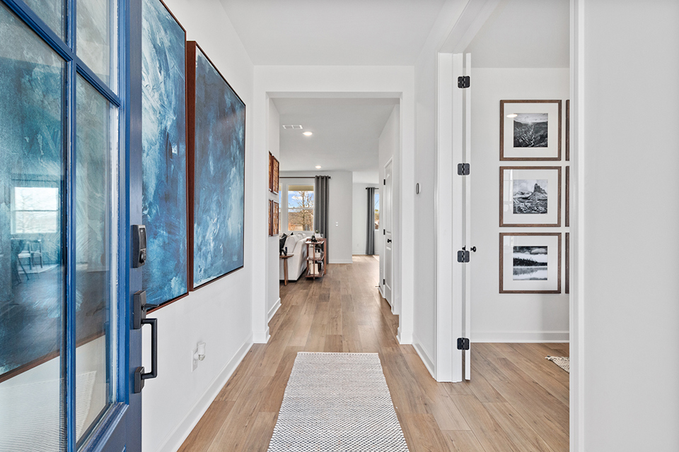 A hallway with glass doors.
