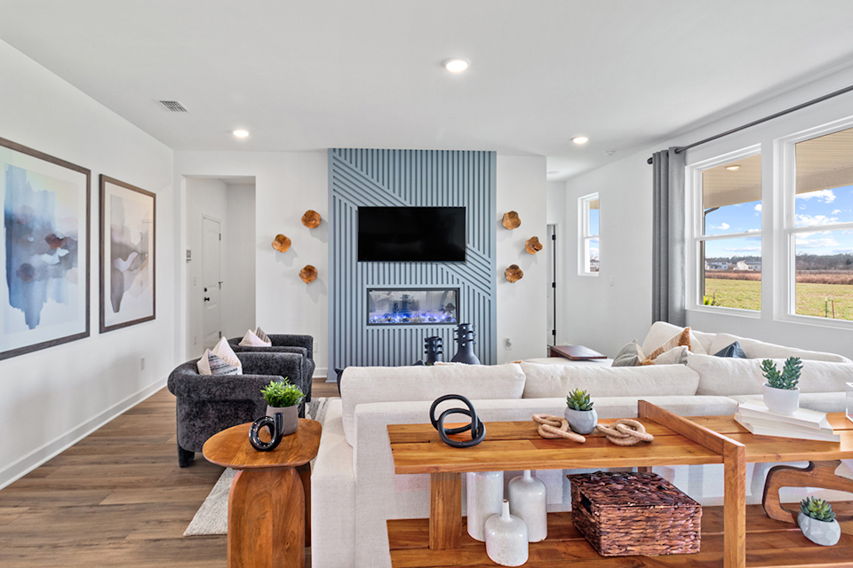 A living room with a tv and couches.