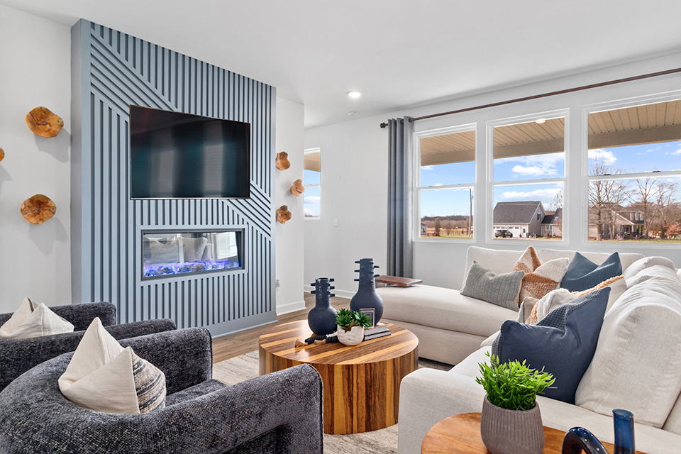 A living room with a tv and couches.