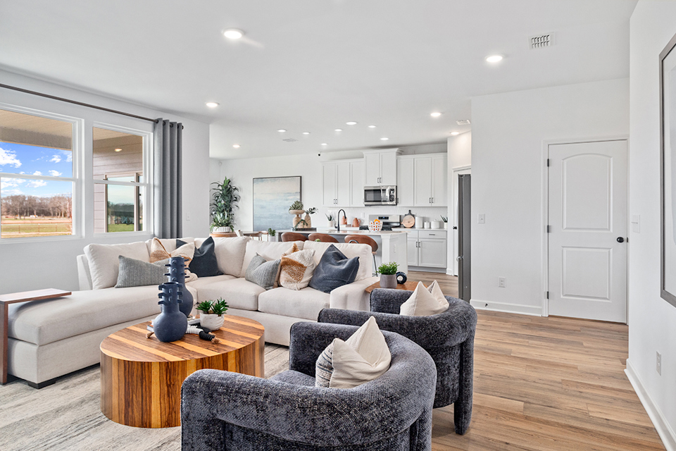 A living room with a couch and a table.
