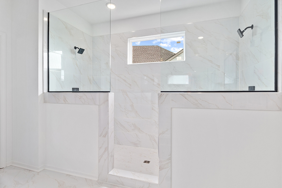 A bathroom with a glass shower.