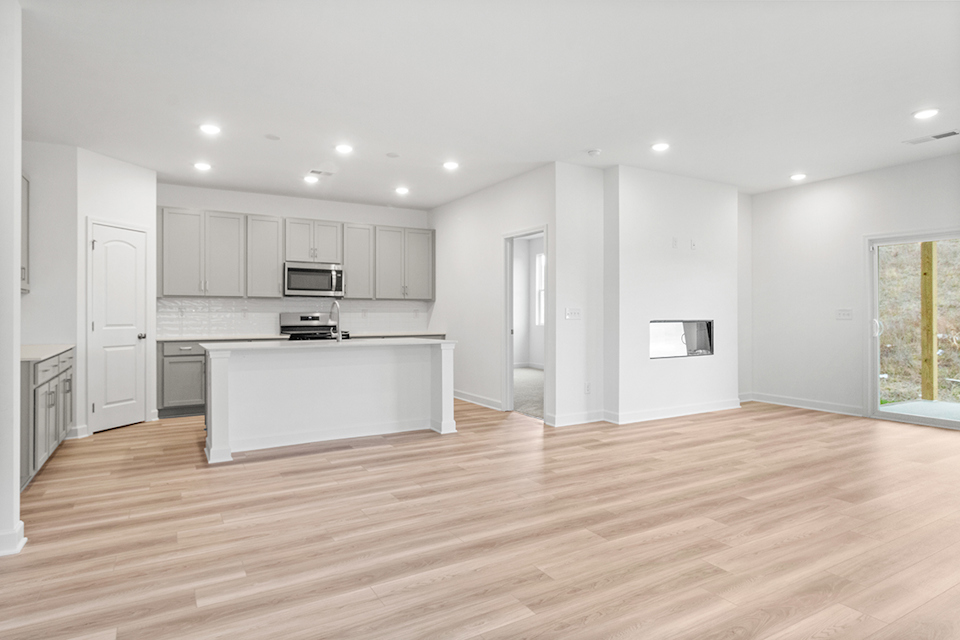 A large kitchen with white cabinets.