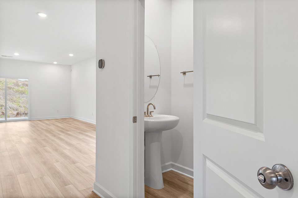 A bathroom with a sink and a mirror.