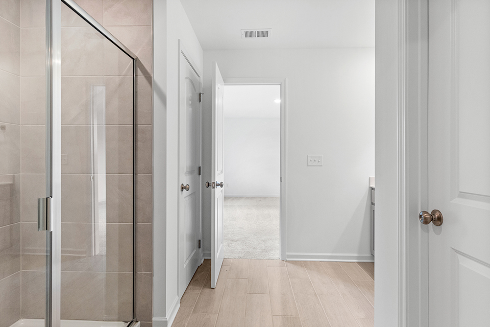 A bathroom with a glass shower.