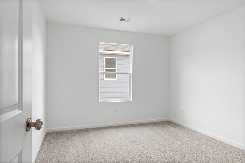 A room with a door and a window.