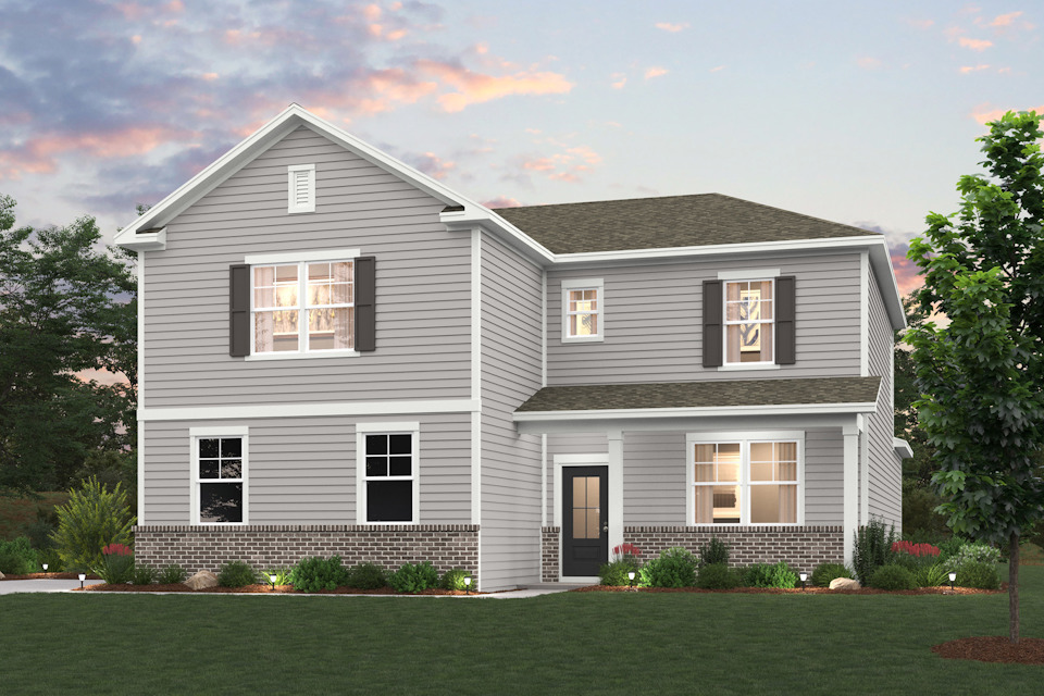 A grey house with a lawn.