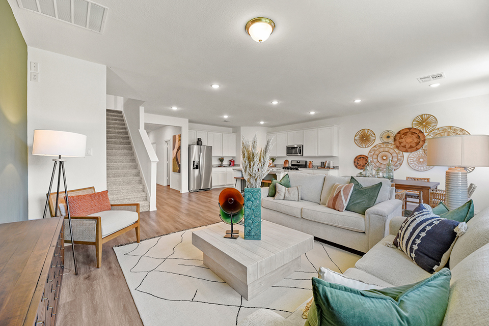 A living room with a staircase.