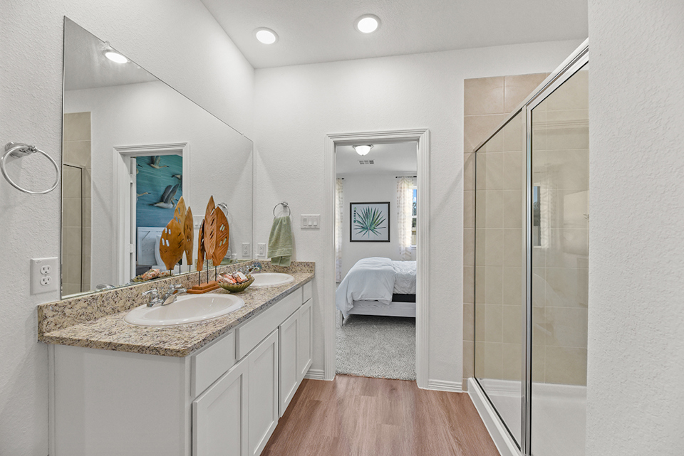 A bathroom with a glass shower.