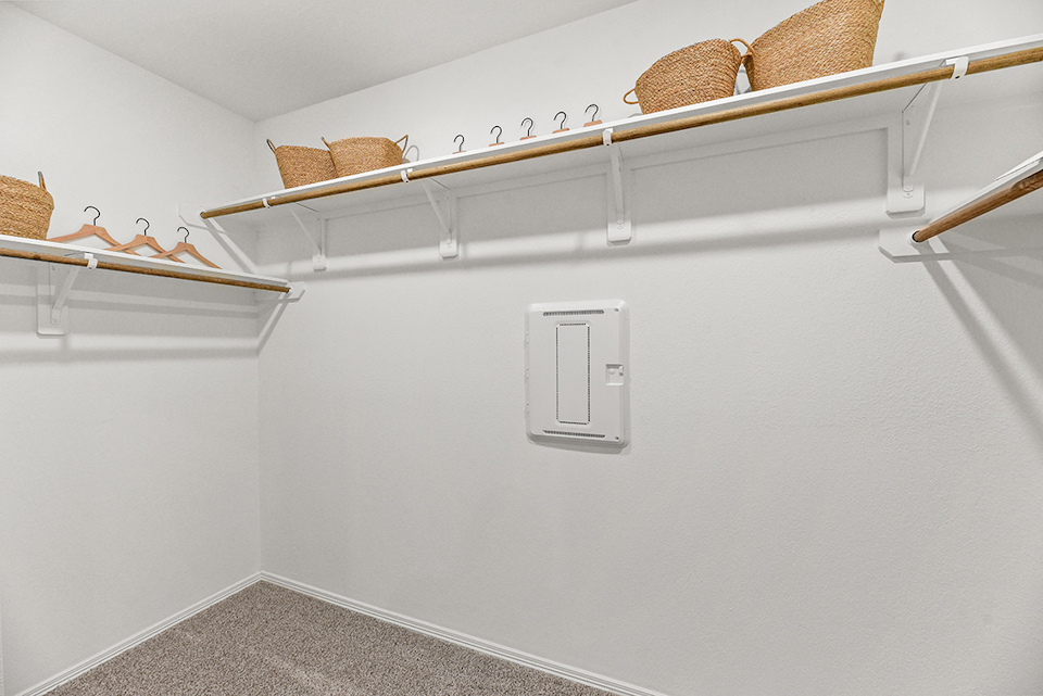 A white wall with a light fixture.