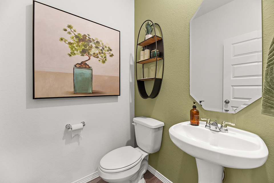 A bathroom with a sink and a toilet.