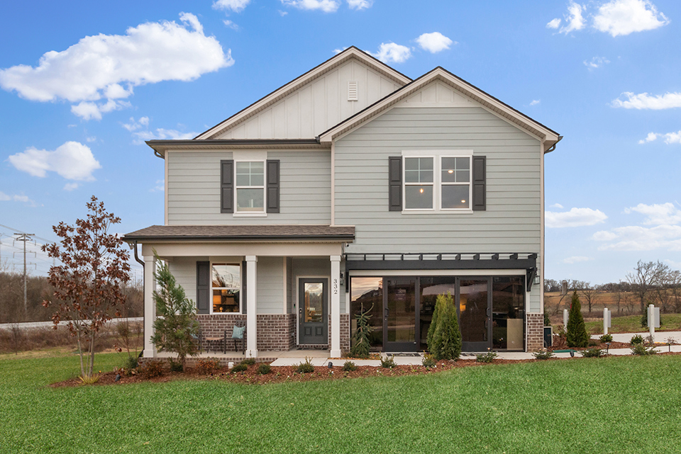 A house with a lawn in front.