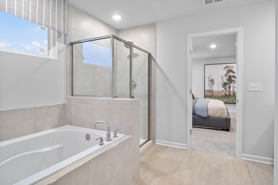 A bathroom with a tub and a sink.