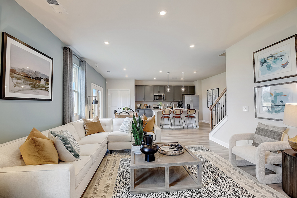 A living room with a dining table and couches.