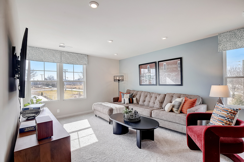 A living room with a couch and a coffee table.
