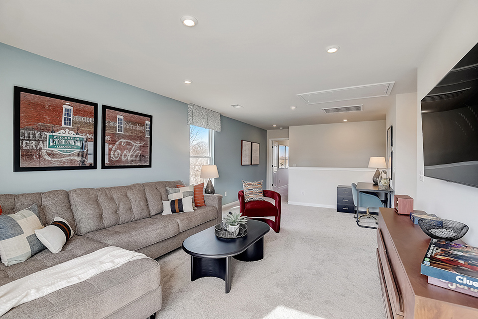 A living room with a couch and a coffee table.