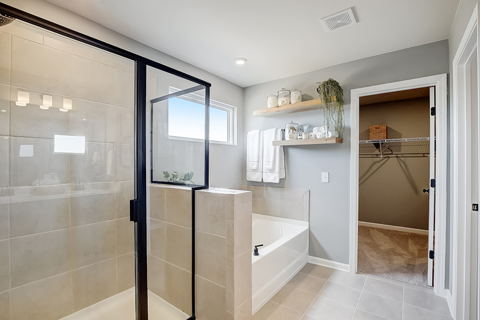 A bathroom with a glass shower.