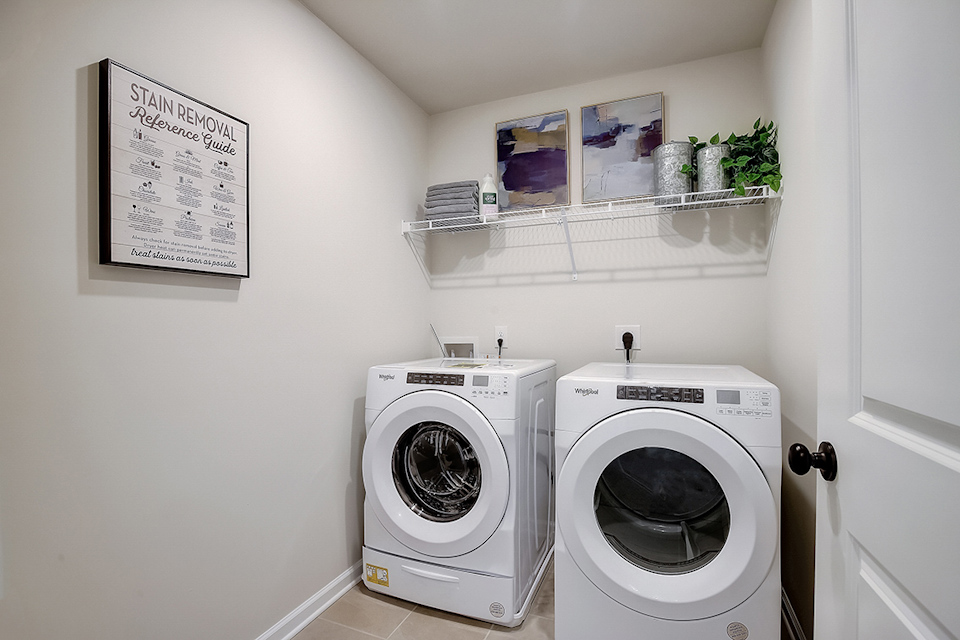 A washing machine in a room.