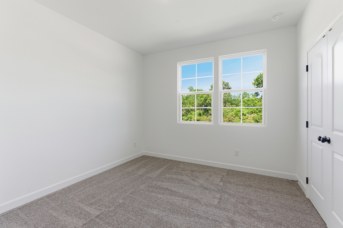 A room with a window and a door.