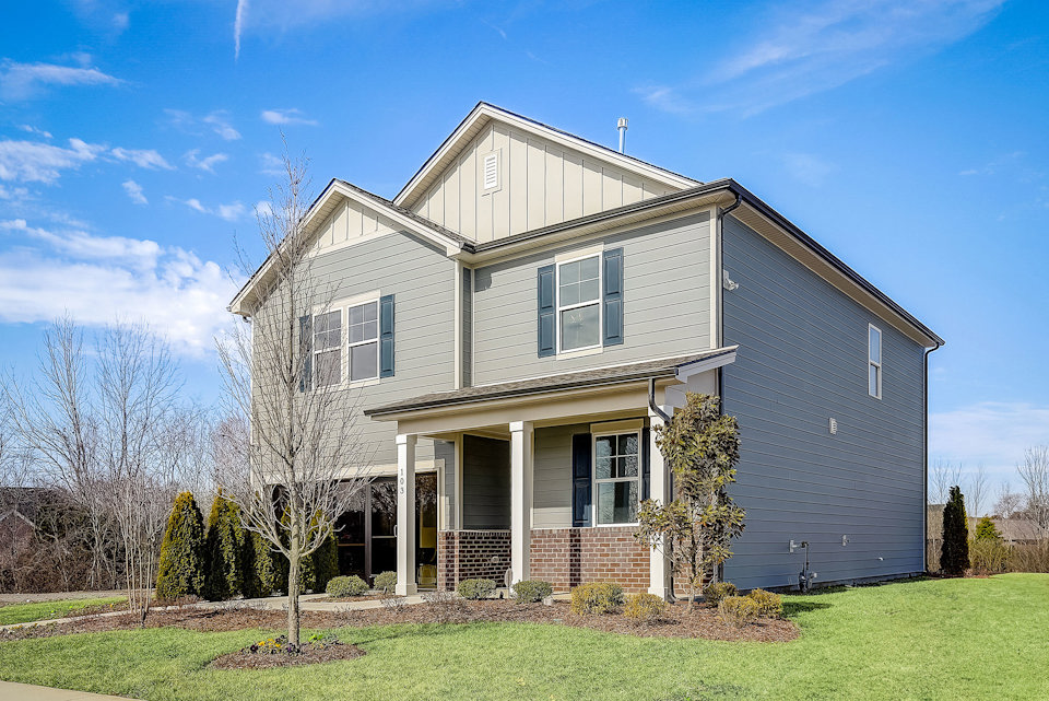 A house with a large front yard.