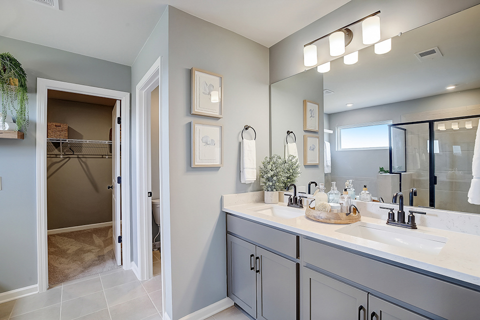 A bathroom with a large mirror.