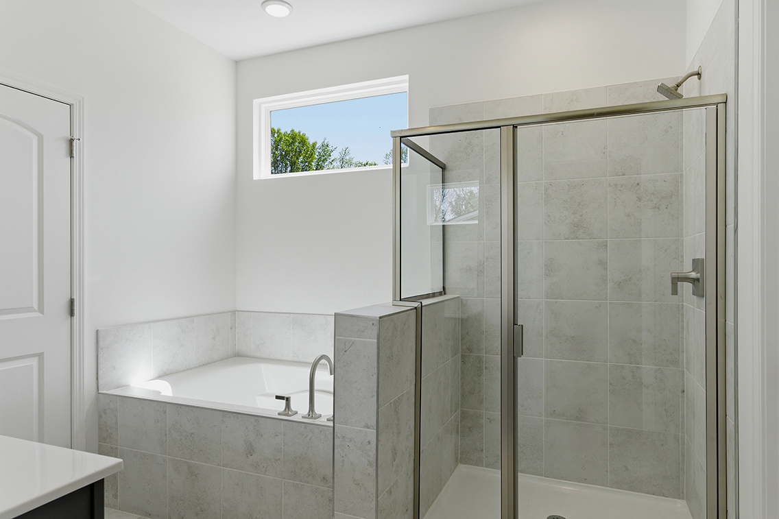 A bathroom with a glass shower.