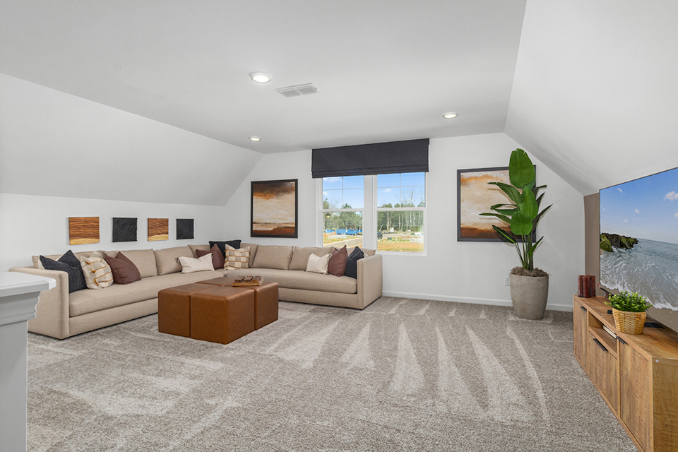 A living room with a couch and a table.