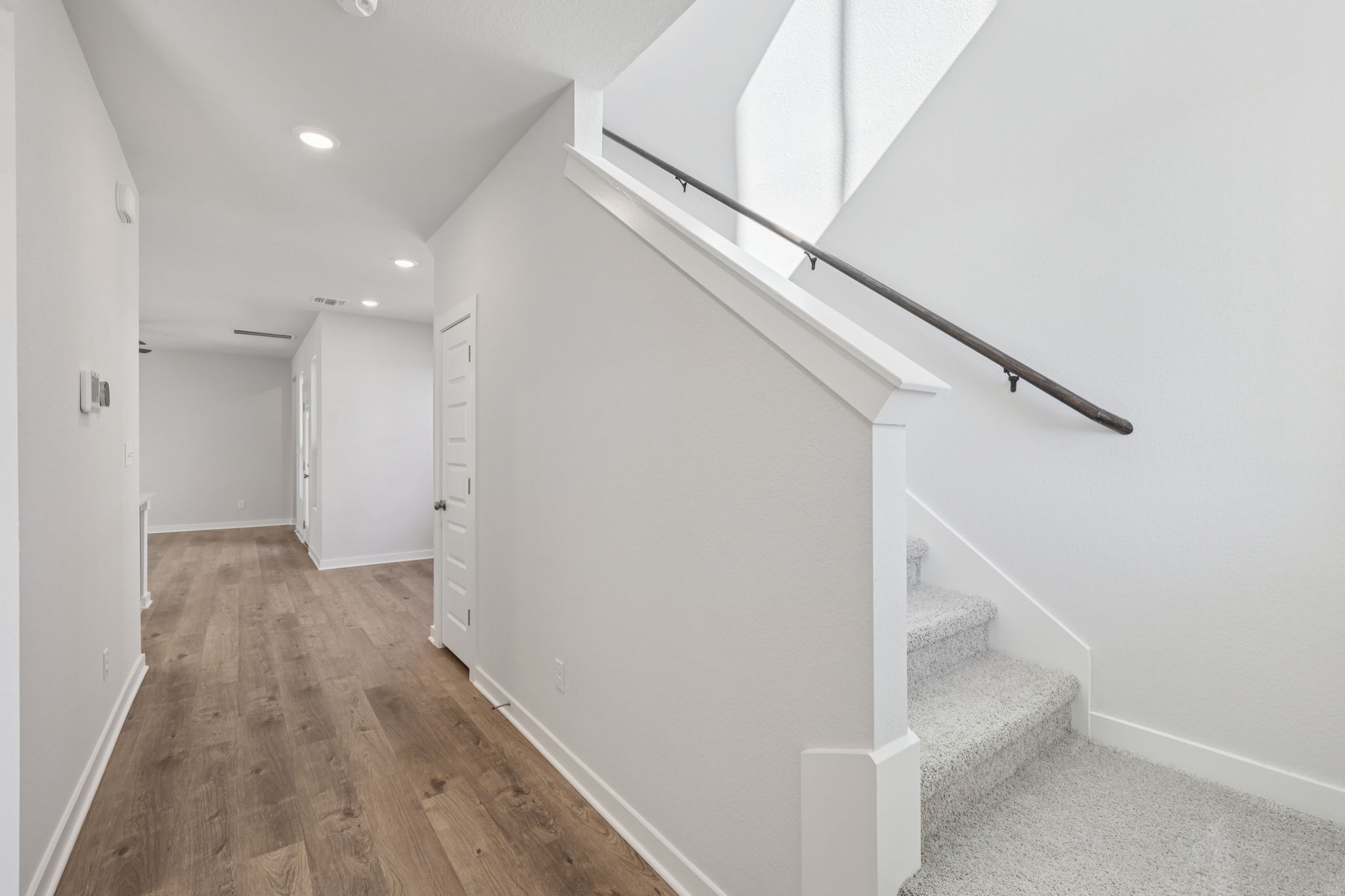 A white hallway with white walls.