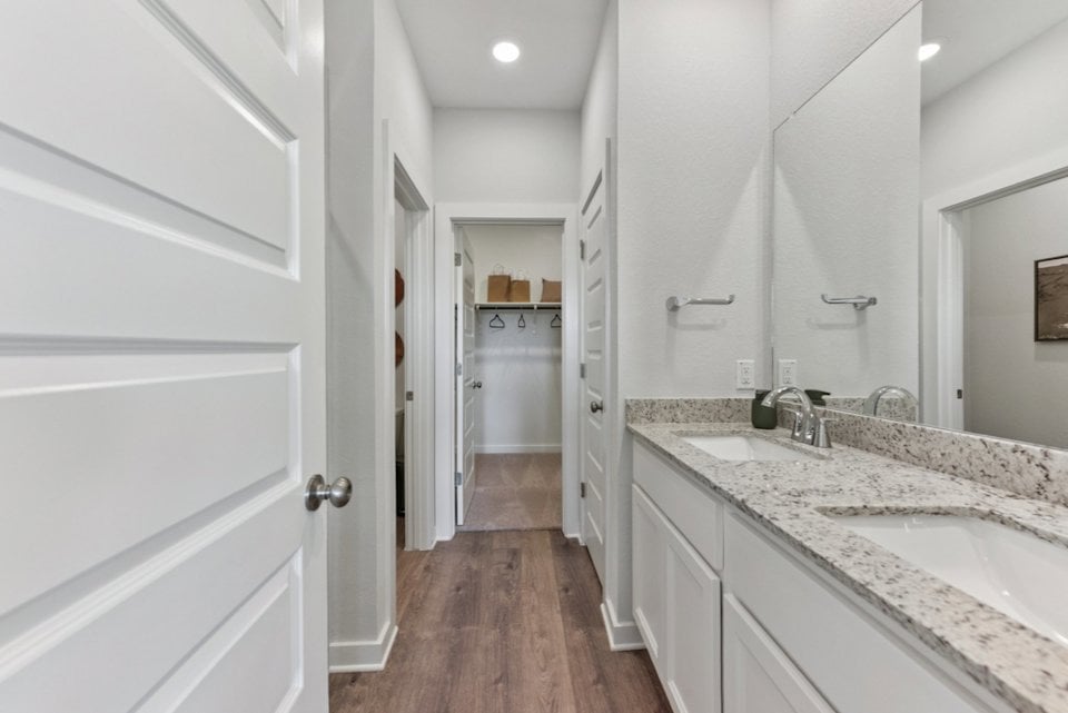 A bathroom with a marble countertop.