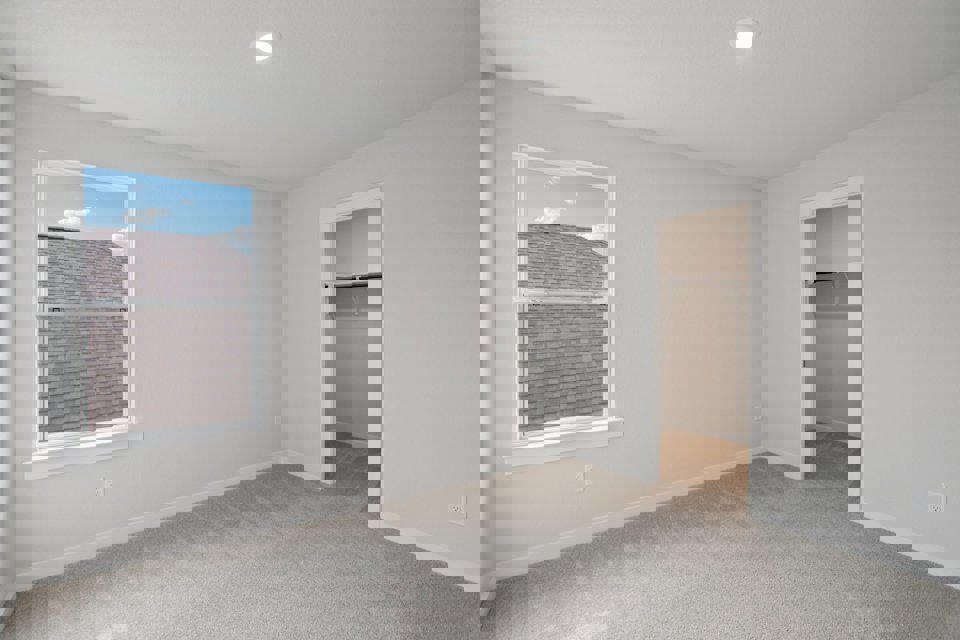 A room with a window and a door.
