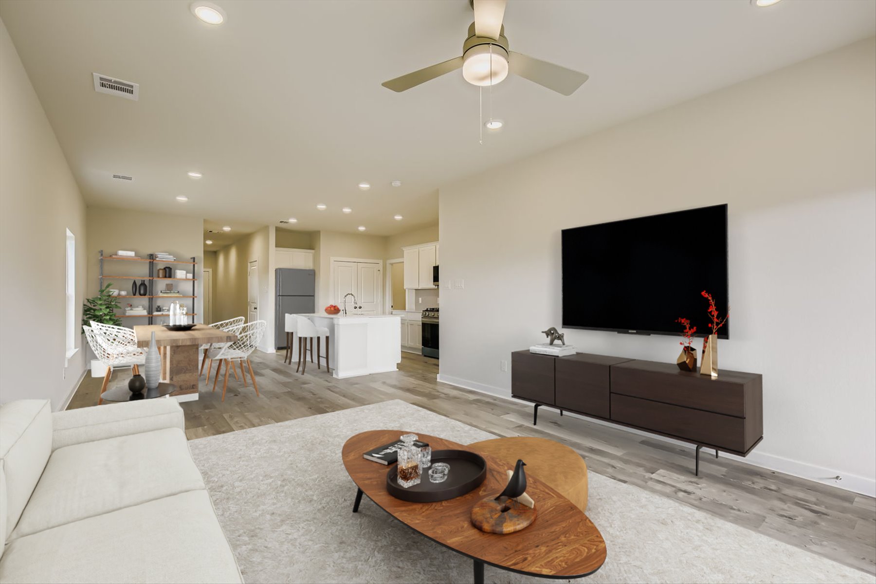 A living room with a tv and furniture.