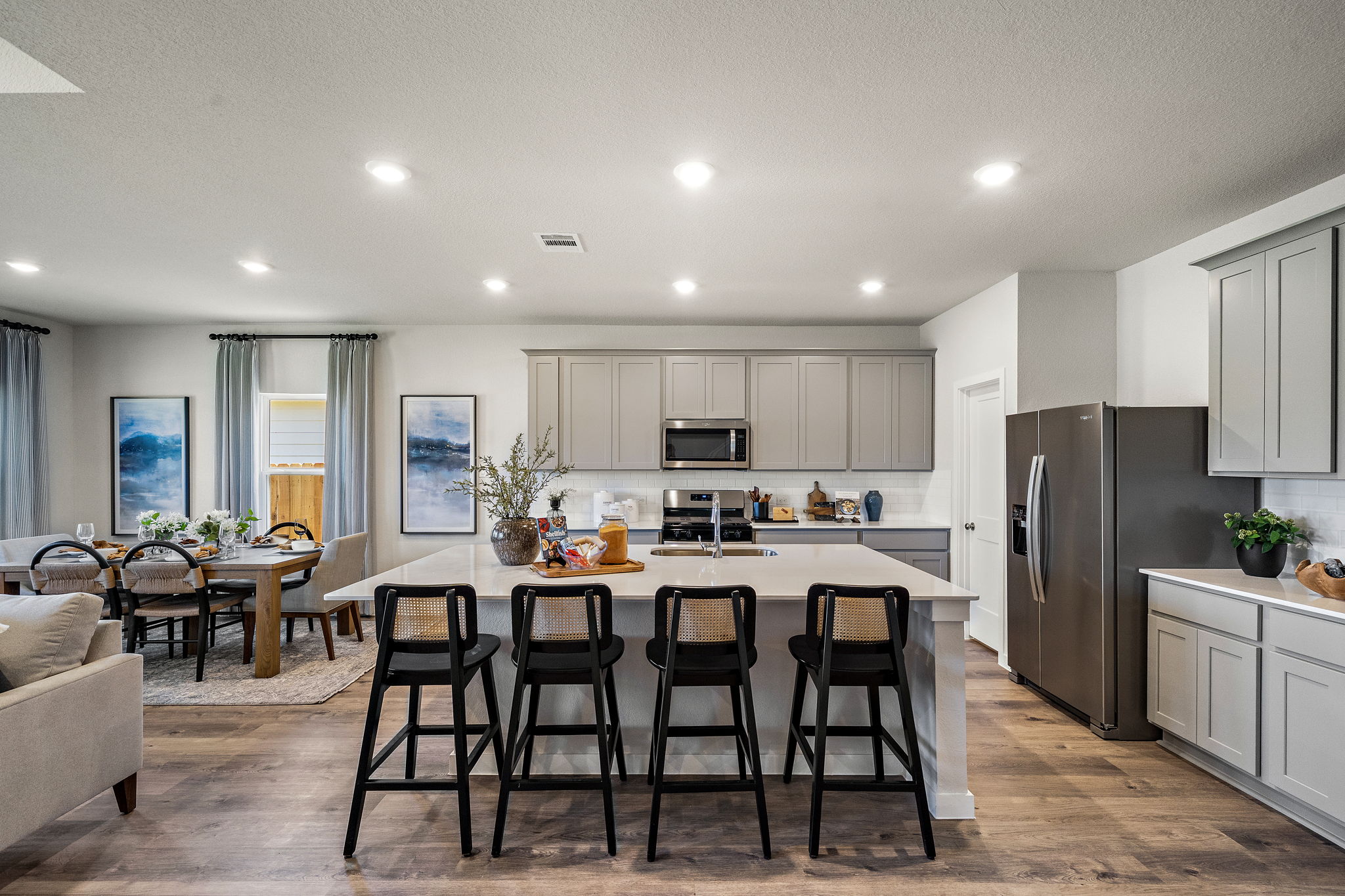 A kitchen with a dining table.