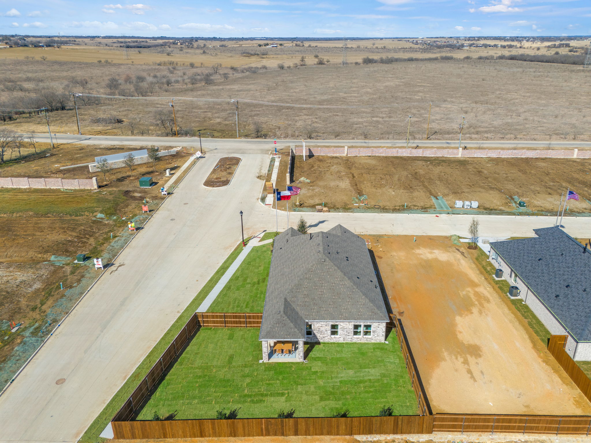 A farm with a barn and fields.