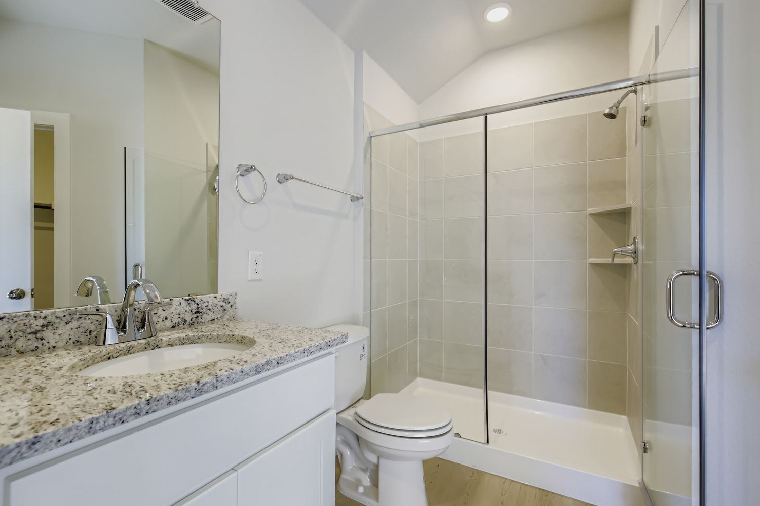 A bathroom with a glass shower.