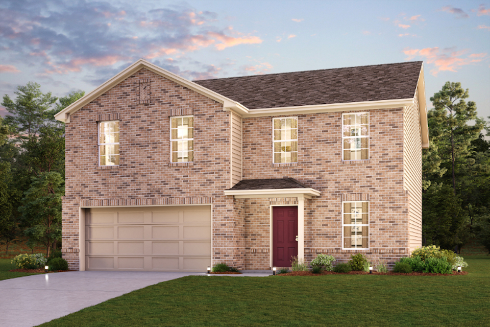 A brick house with a garage.