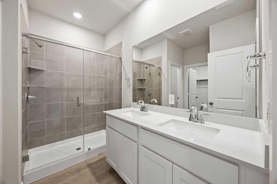 A bathroom with a glass shower.