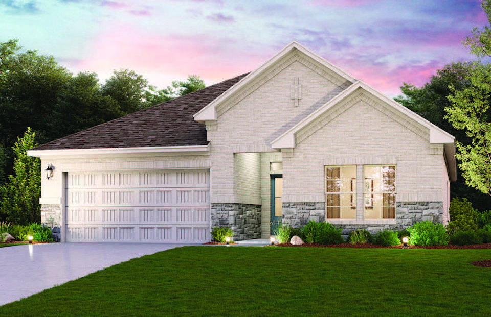 A house with a lawn in front of it.