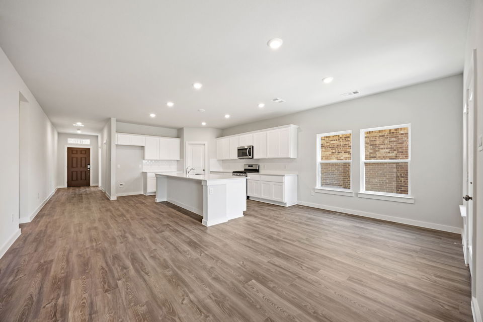 A large kitchen with white cabinets.