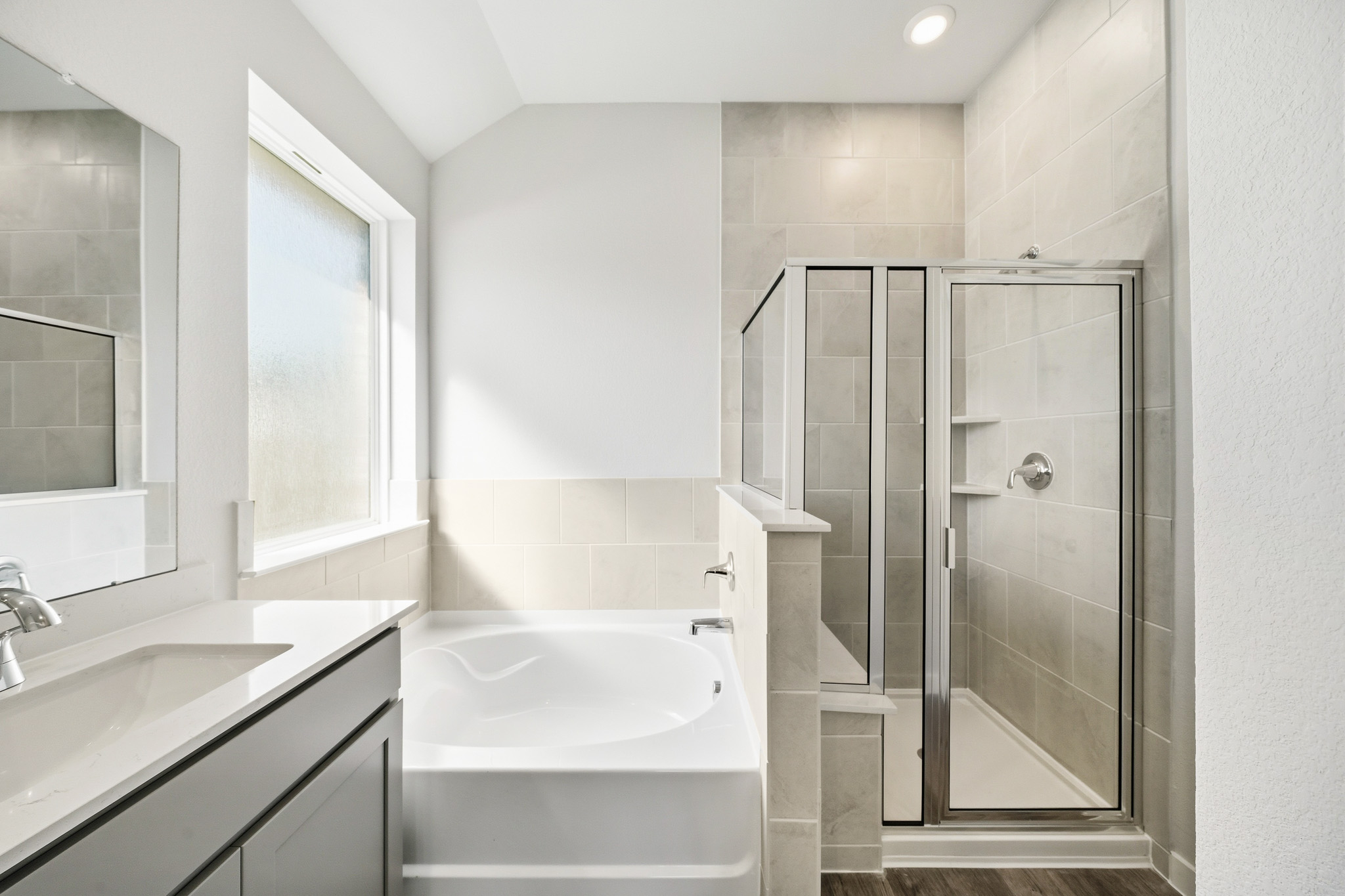 A bathroom with a glass shower.