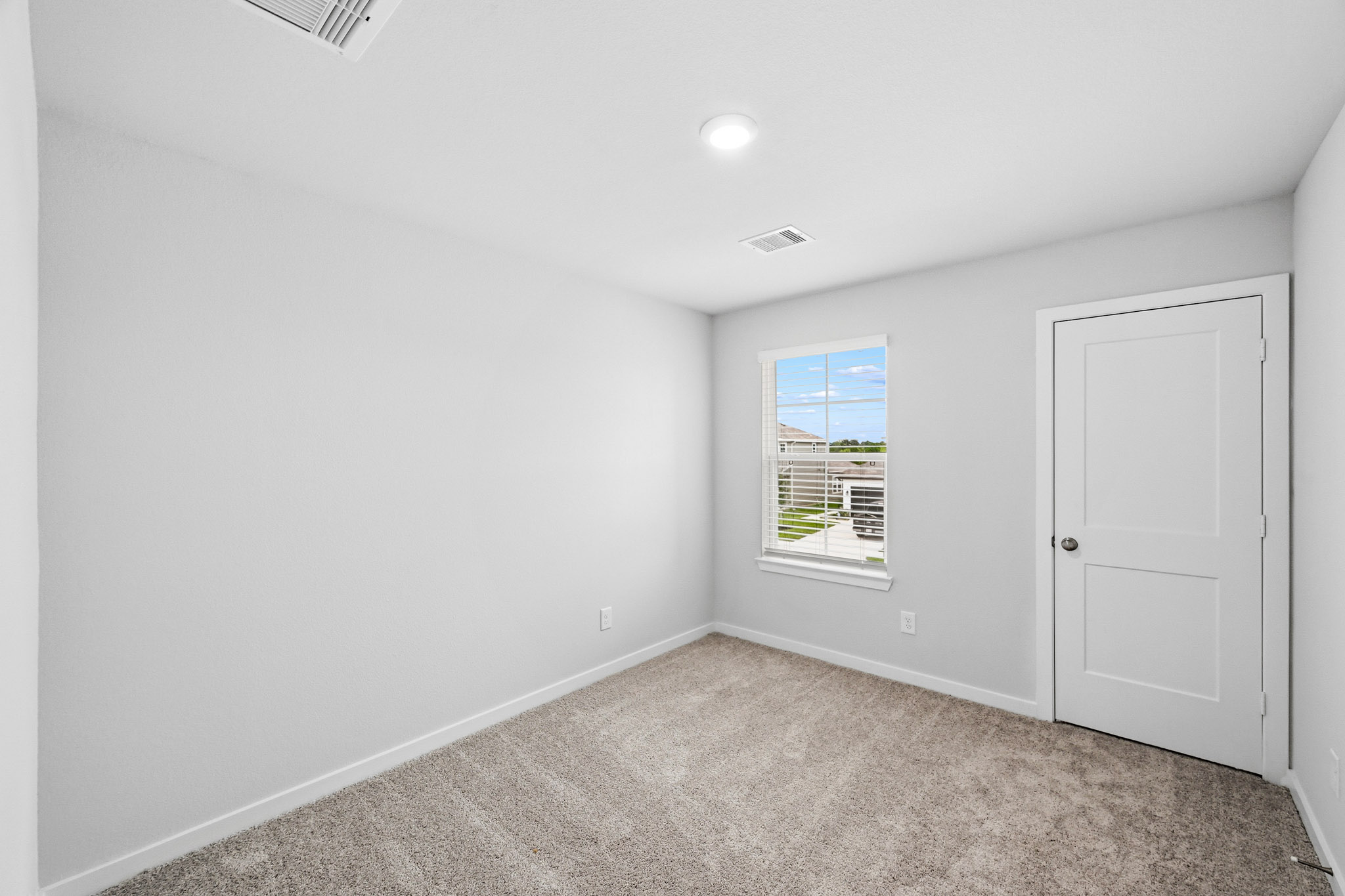 A room with a door and a window.
