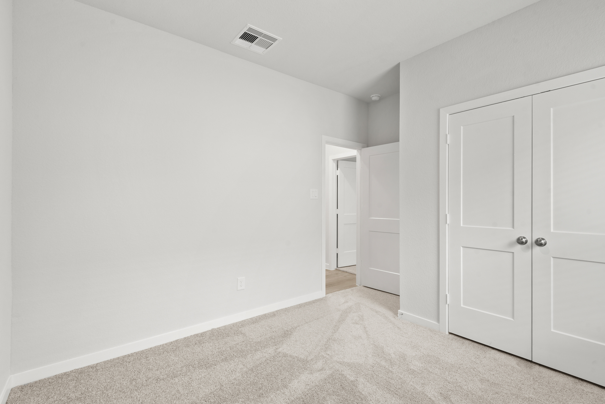 A room with white doors.