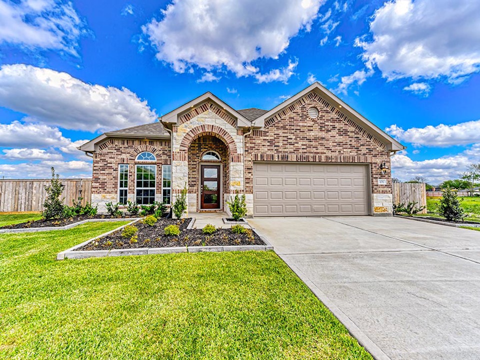 A house with a garage and a driveway.