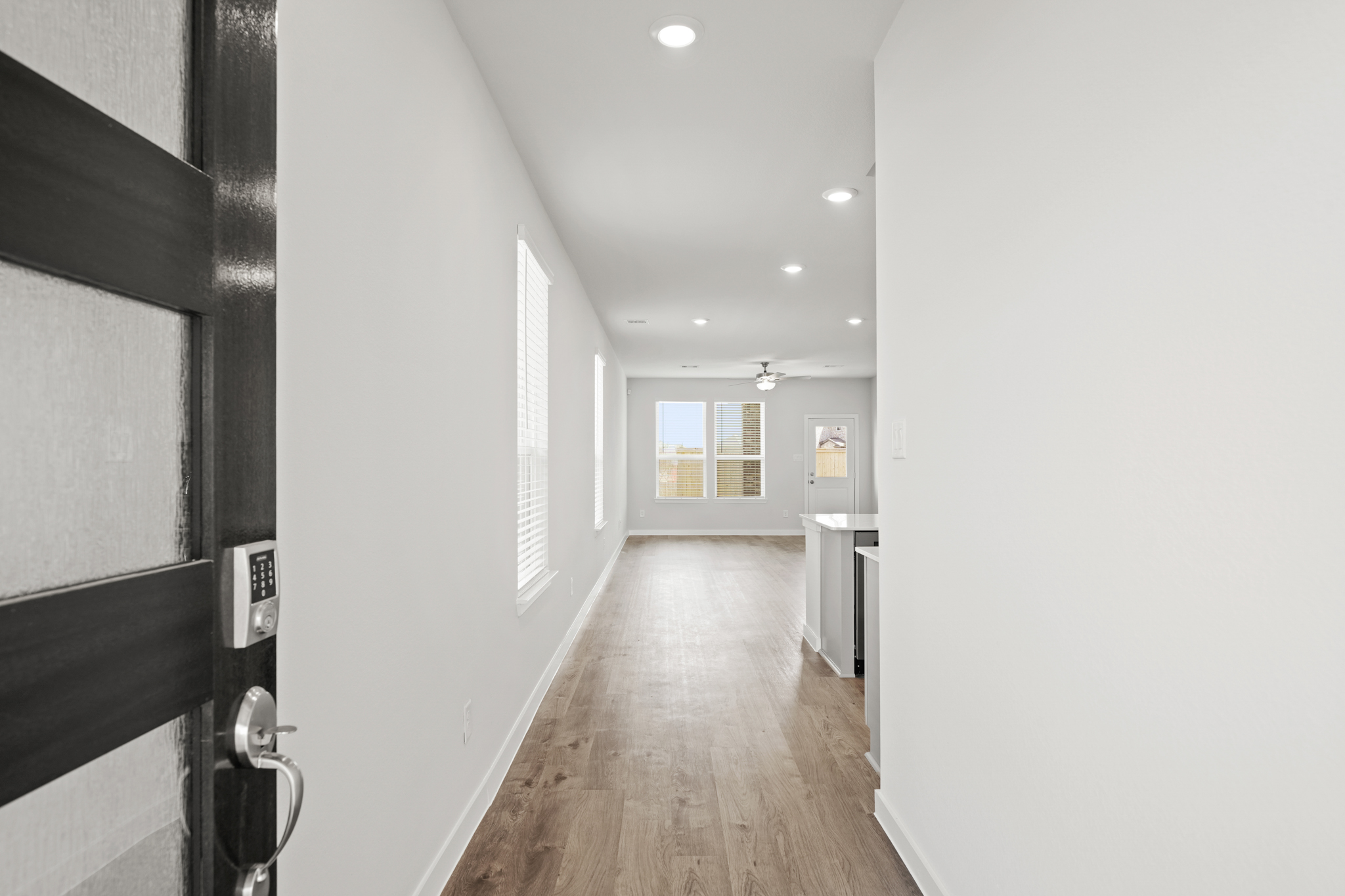 A hallway with white walls.